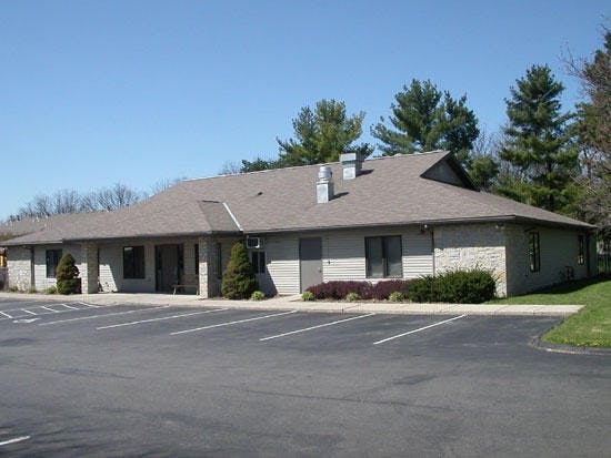Building with a parking lot in front