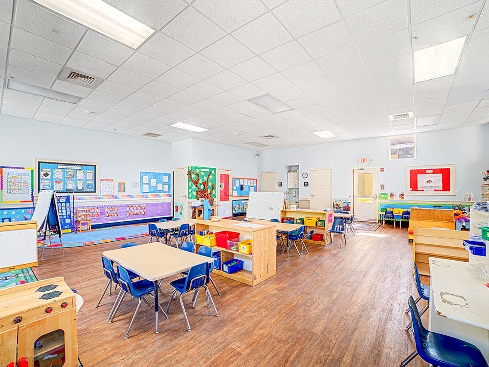 Empty classroom with tables and chairs