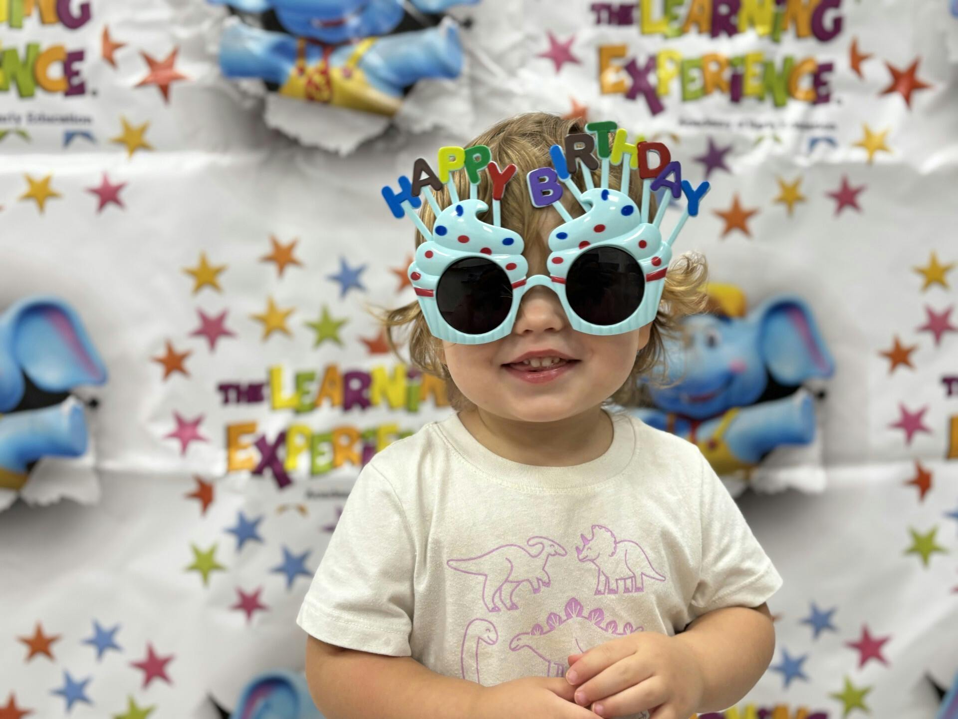 Child wearing novelty Happy Birthday glasses