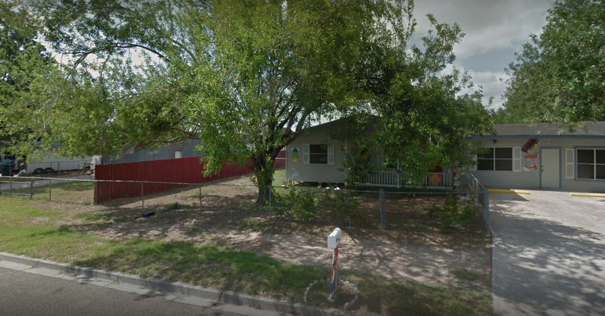 House with a tree in front and a mailbox