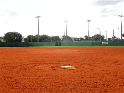Baseball field with a dirt infield and a white home plate