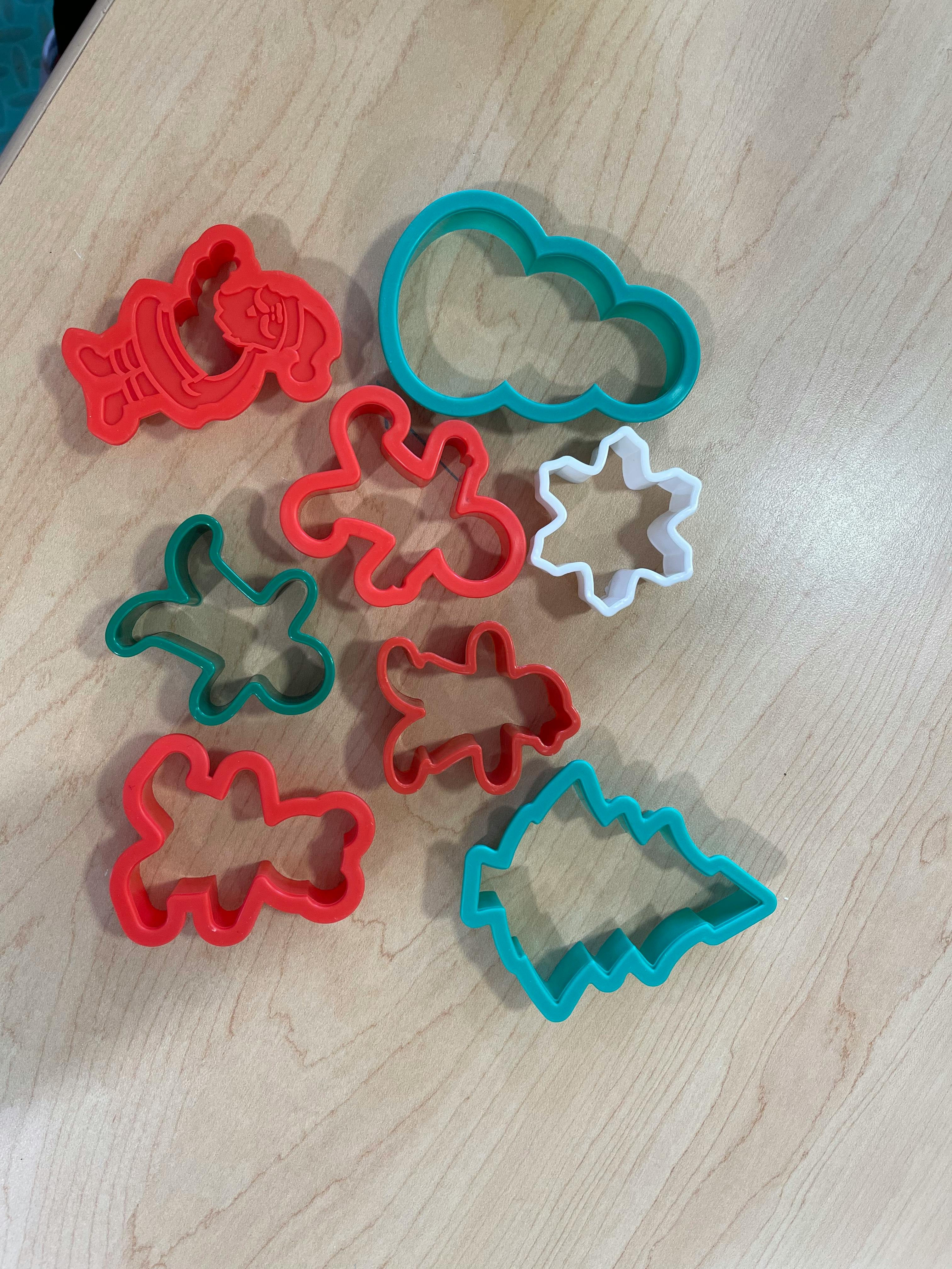 Assortment of colorful cookie cutters in various shapes