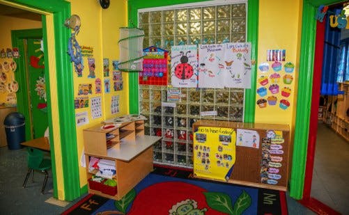 Colorful classroom with children's artwork and furniture