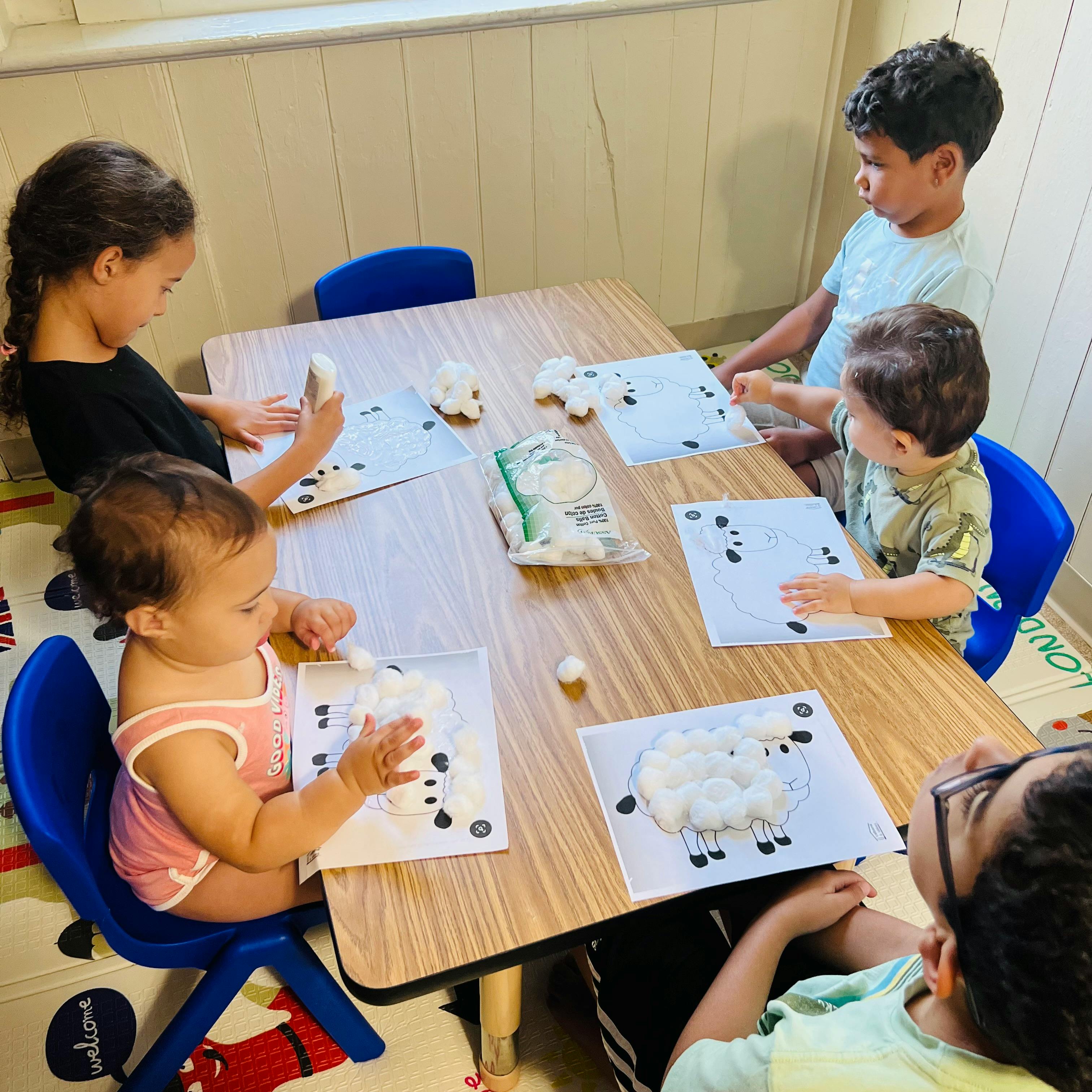 Children doing an art activity at a table