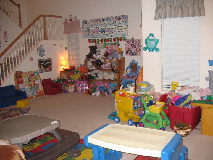 Playroom with toys, stuffed animals, and a small table