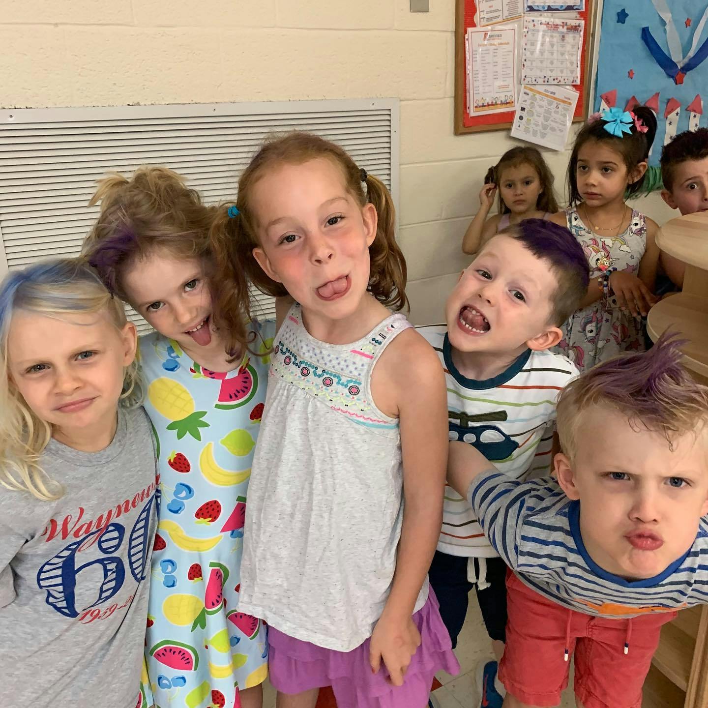 Group of children making funny faces