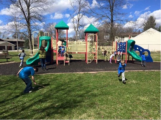Children playing on a playground structure