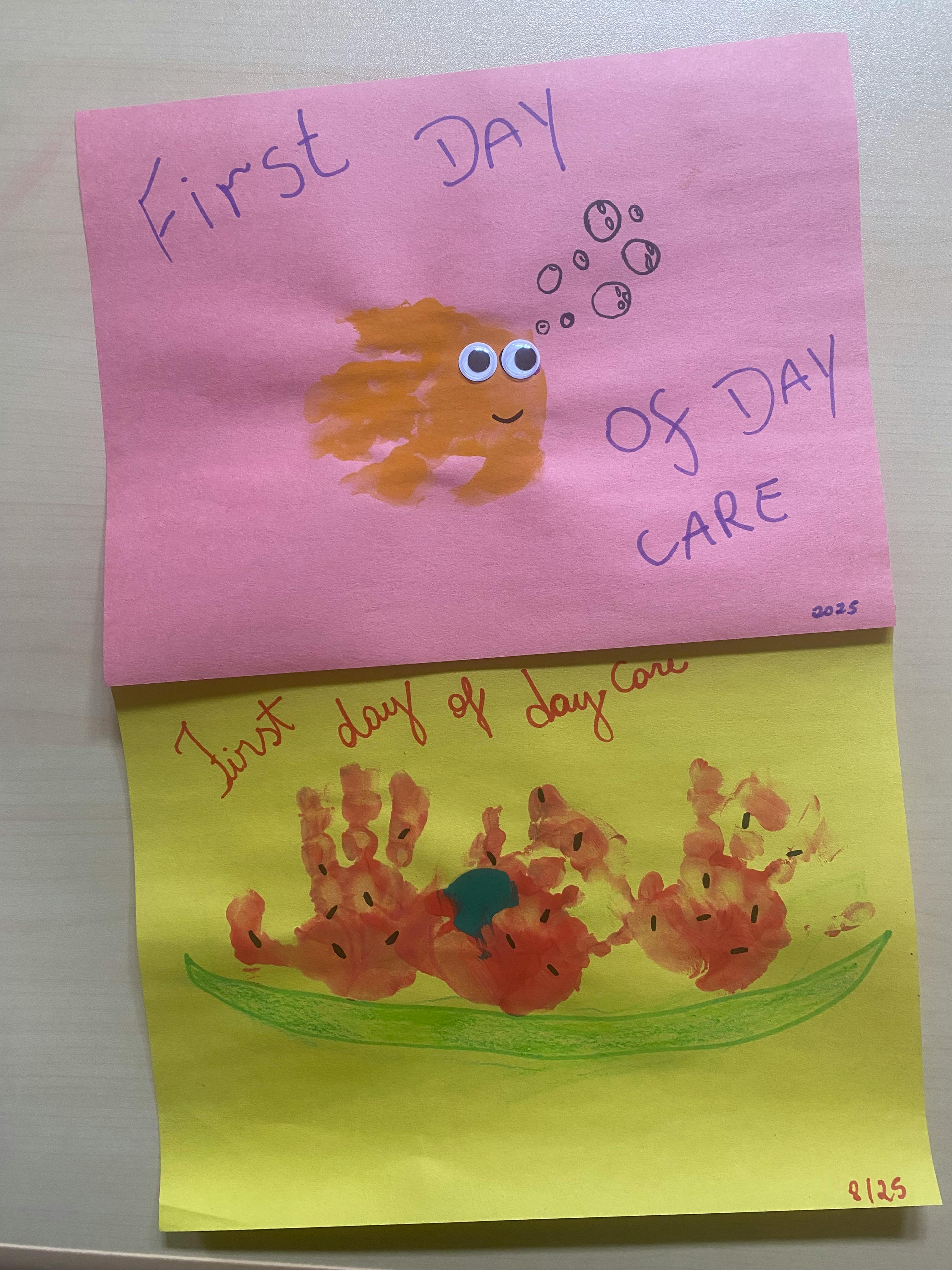 Two pieces of paper with child's artwork, one with a fish and text "First Day of Day Care"
