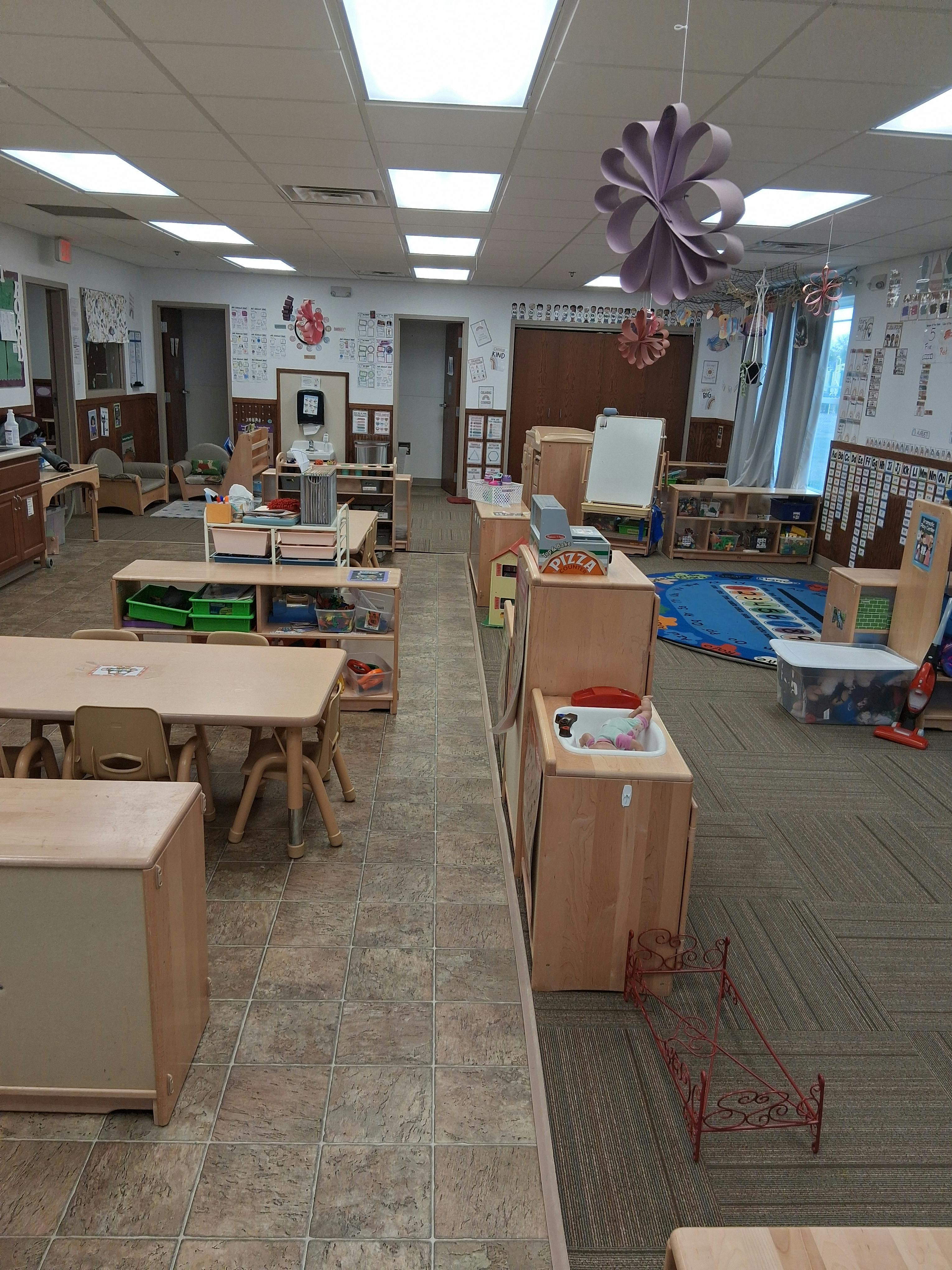 Classroom with tables, chairs, and learning materials