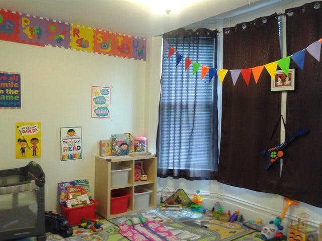 Child's playroom with toys, books, and colorful decorations