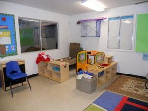 Classroom with play kitchen and small furniture
