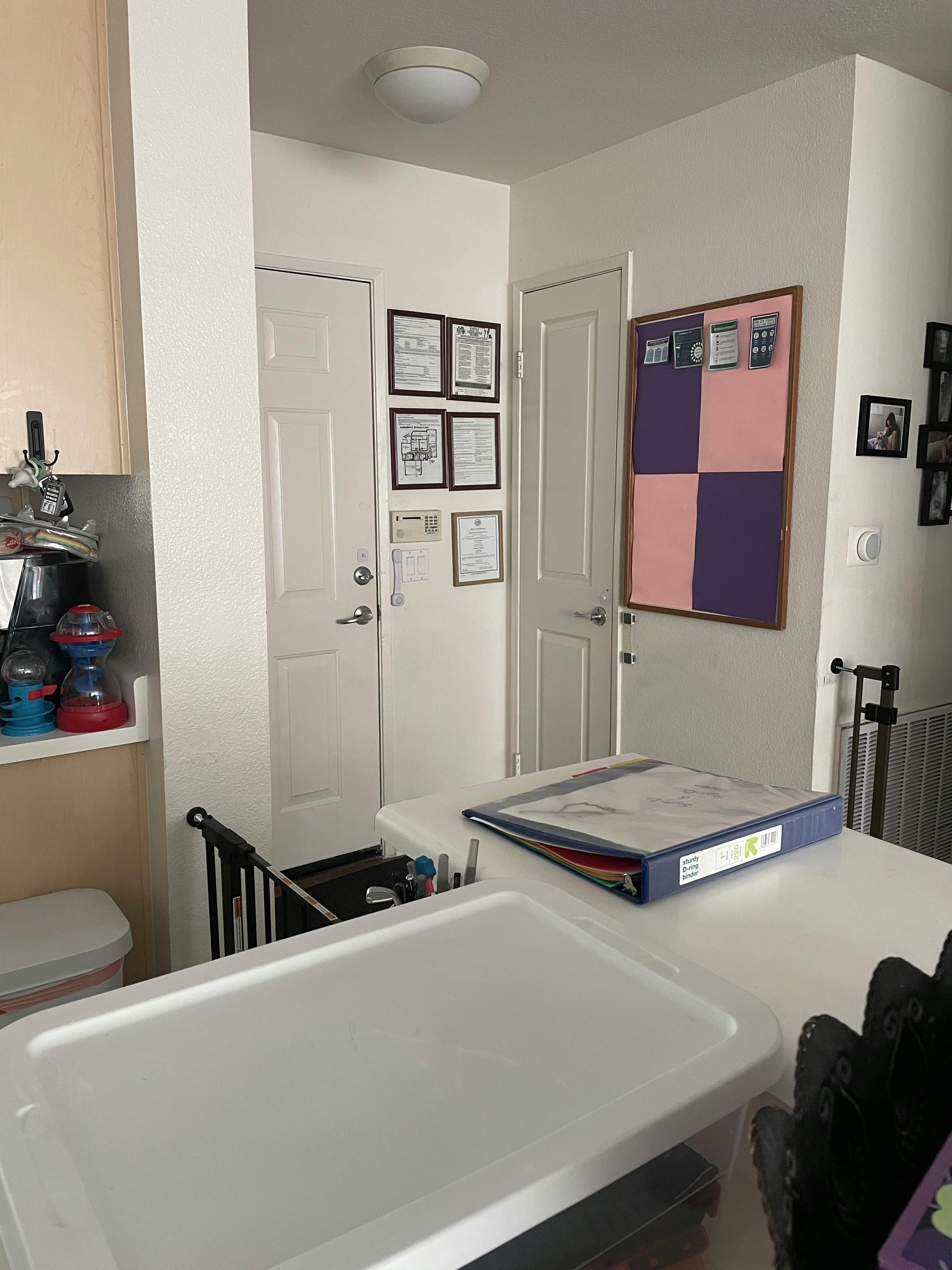 Kitchen counter with a blue binder and white storage container