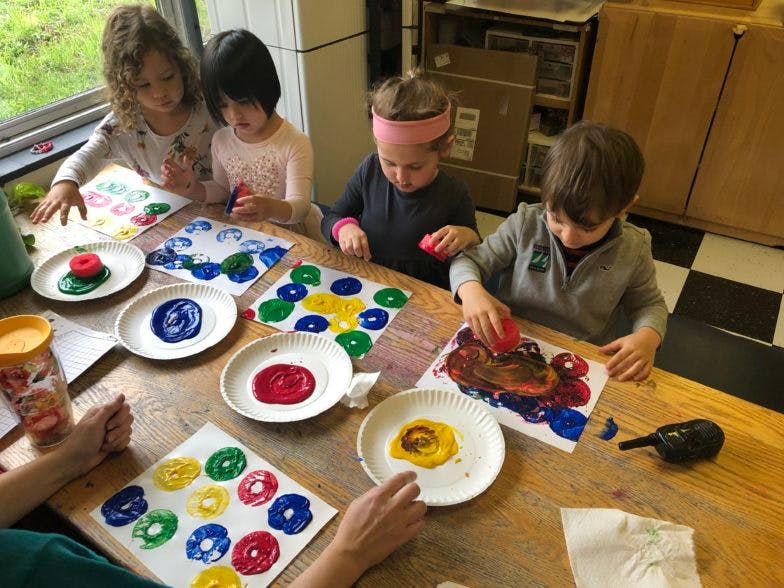 Children doing art projects at a table