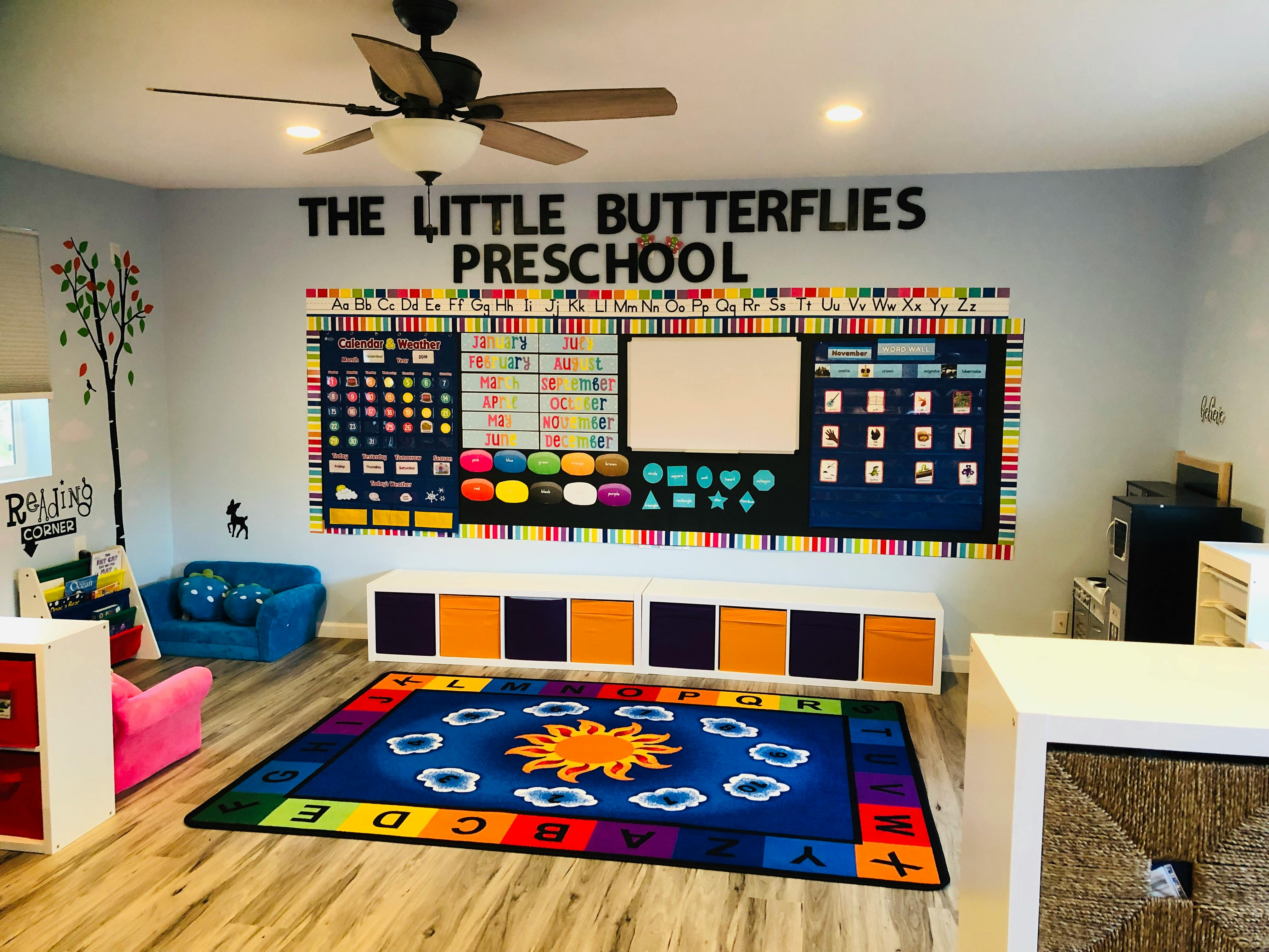 Preschool classroom with a colorful rug and wall decorations