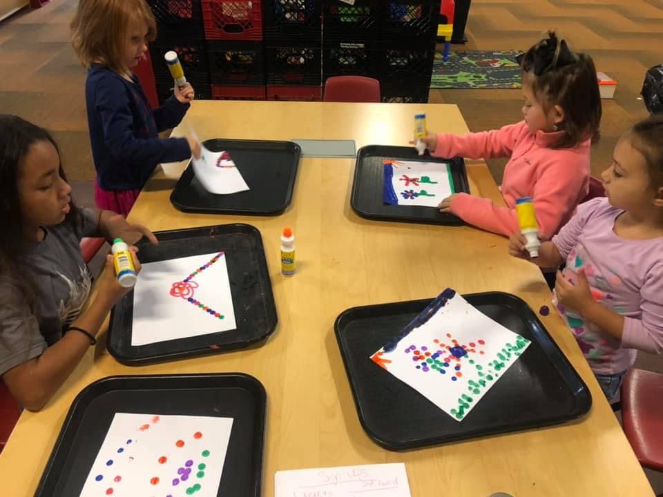 Children doing crafts at a table