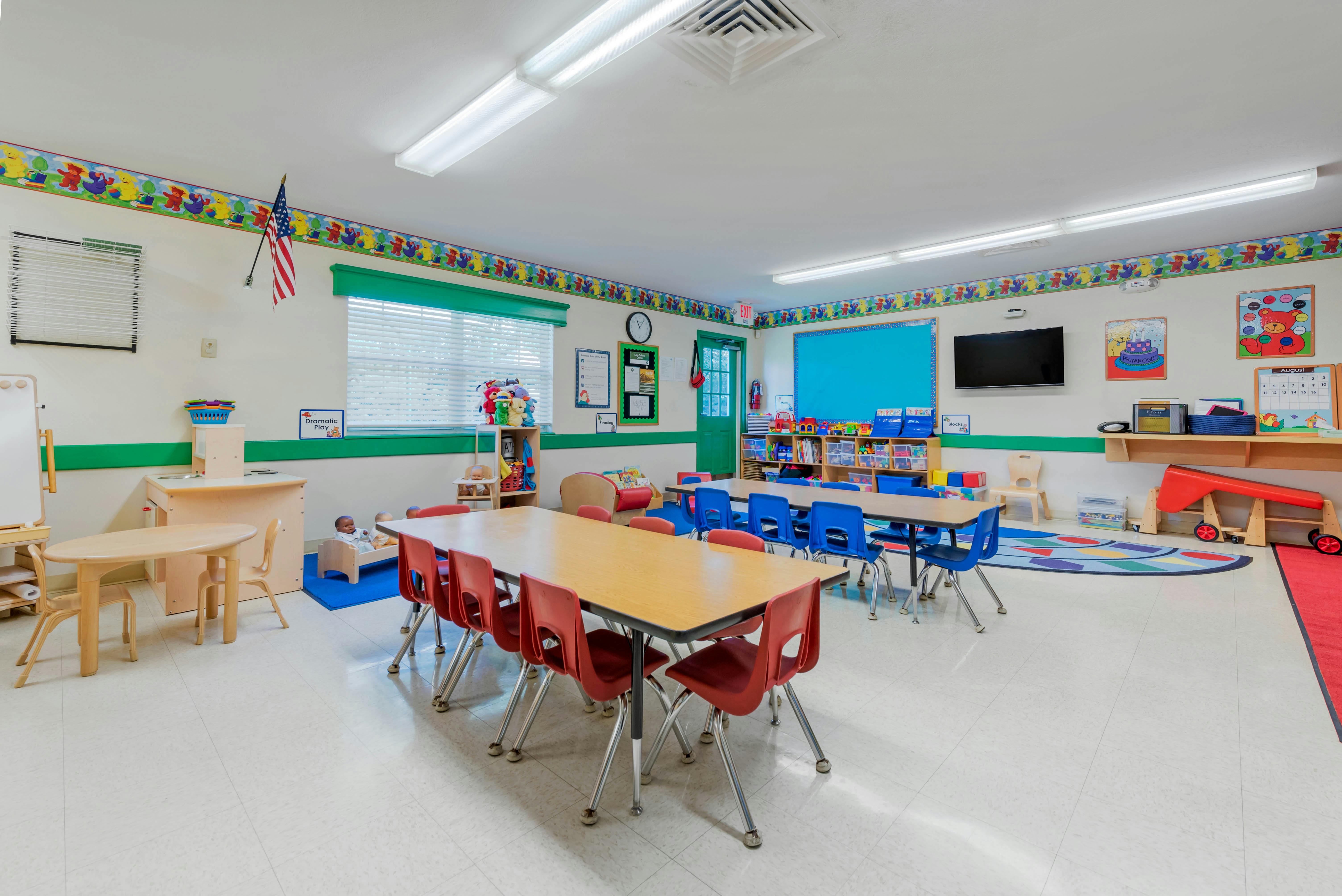 Classroom with tables, chairs, and various learning materials