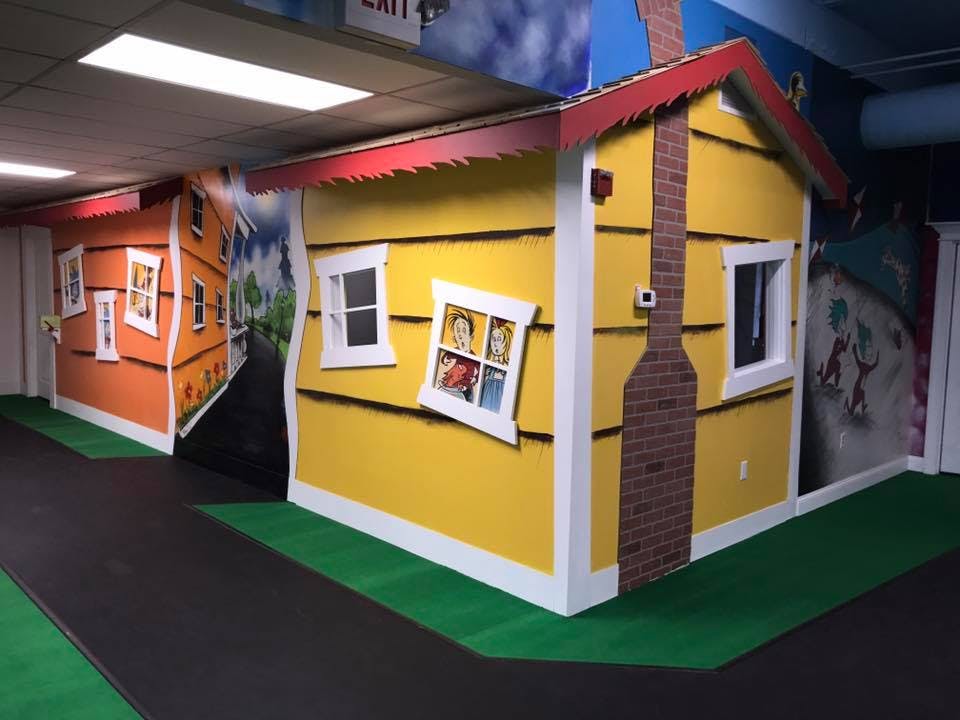 Two playhouses with windows and painted details