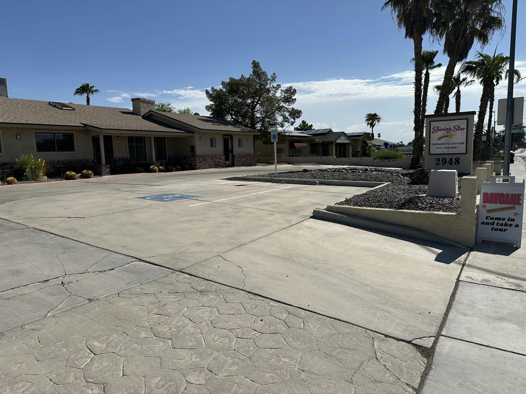 Parking lot and building sign for Shining Star Therapeutic Daycare