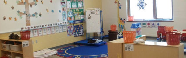 Empty classroom with colorful decorations and furniture