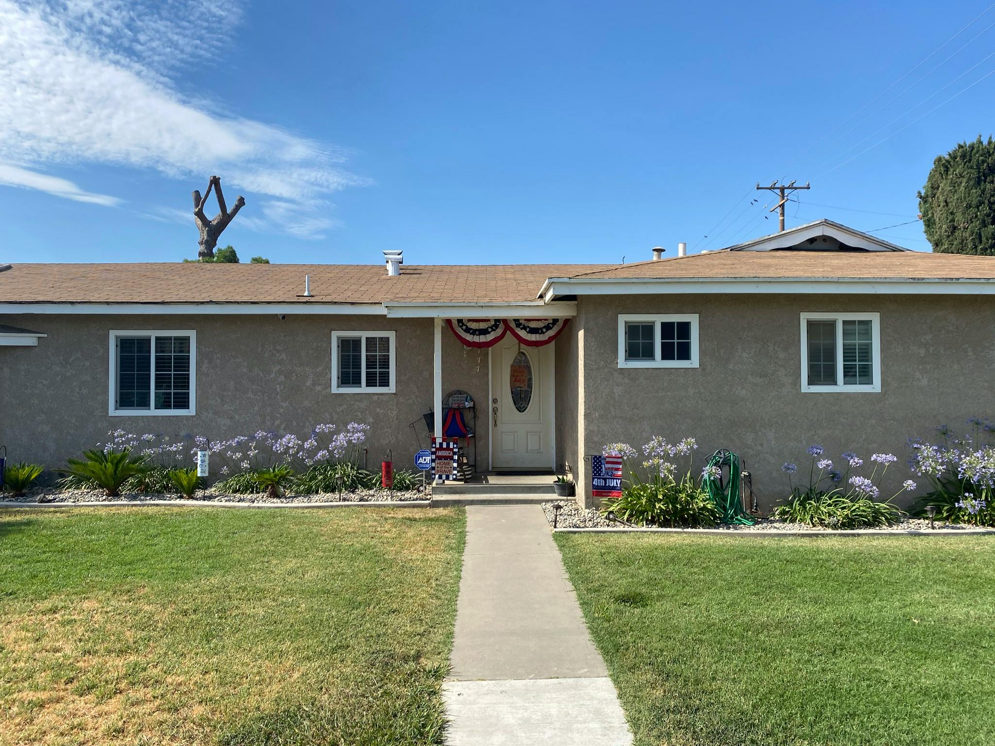 Single-story house with a front yard and walkway