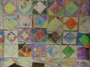 Wall of colorful square art pieces with diamond shapes
