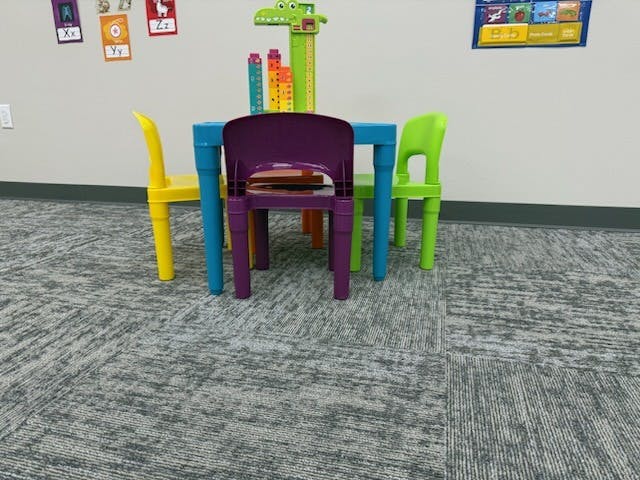 Colorful child-sized table and chairs in a classroom