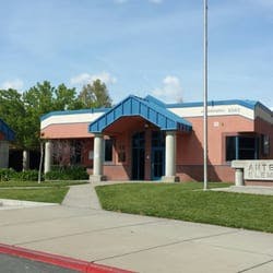 Building with a blue roof and brick facade