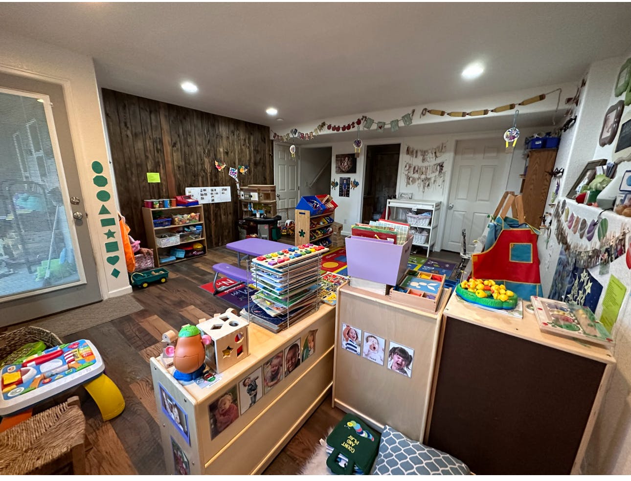 Playroom with toys, books, and child-sized furniture