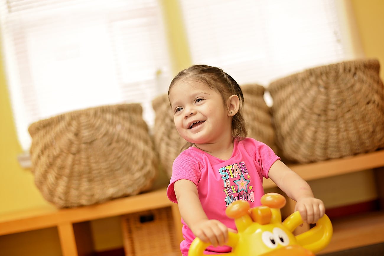 Child on a toy ride-on toy