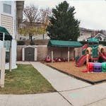 Outdoor playground with slides and covered area