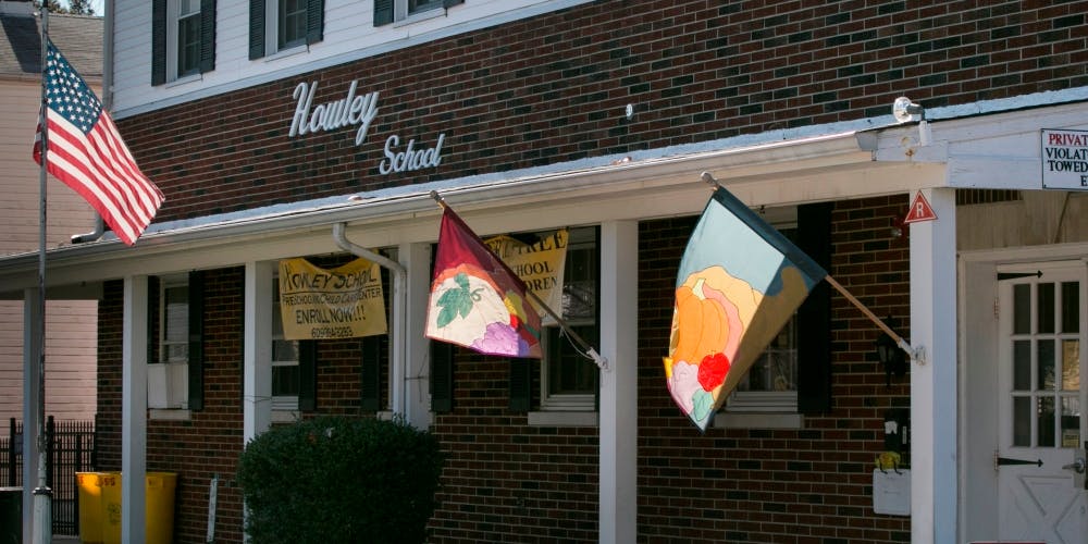 Building with "Howley School" sign and flags