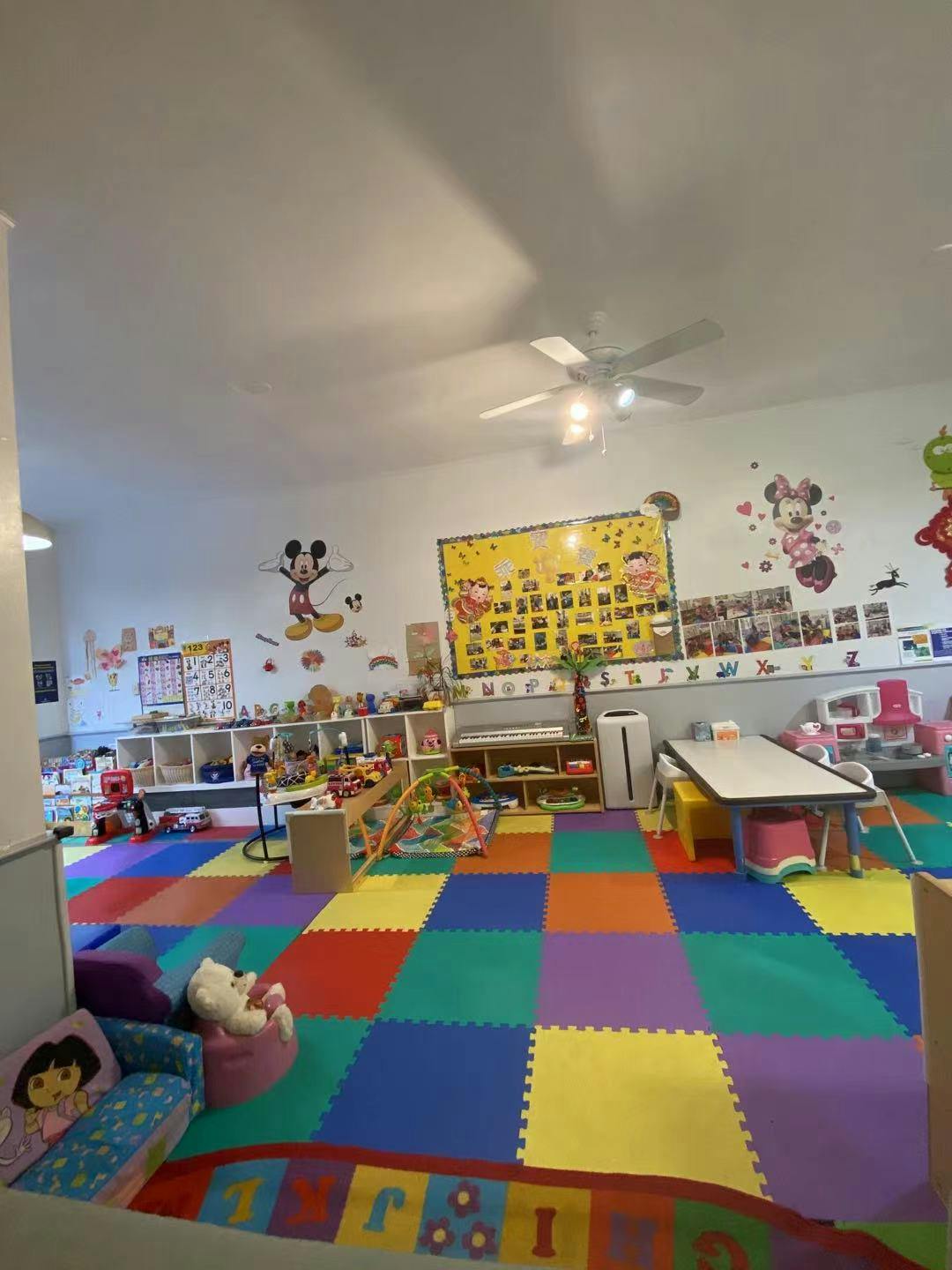 Playroom with colorful floor mats and toys