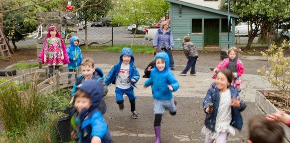 Group of children running outdoors