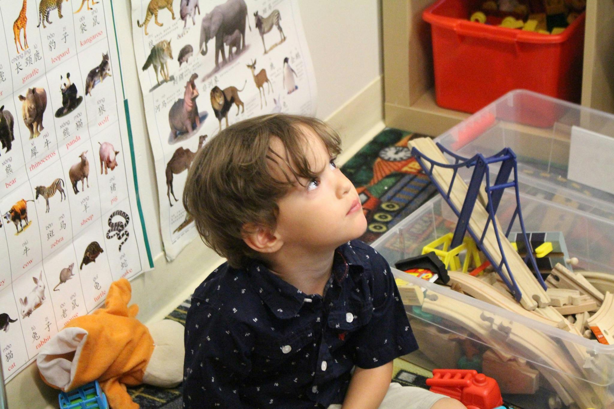 Child looking up in a classroom