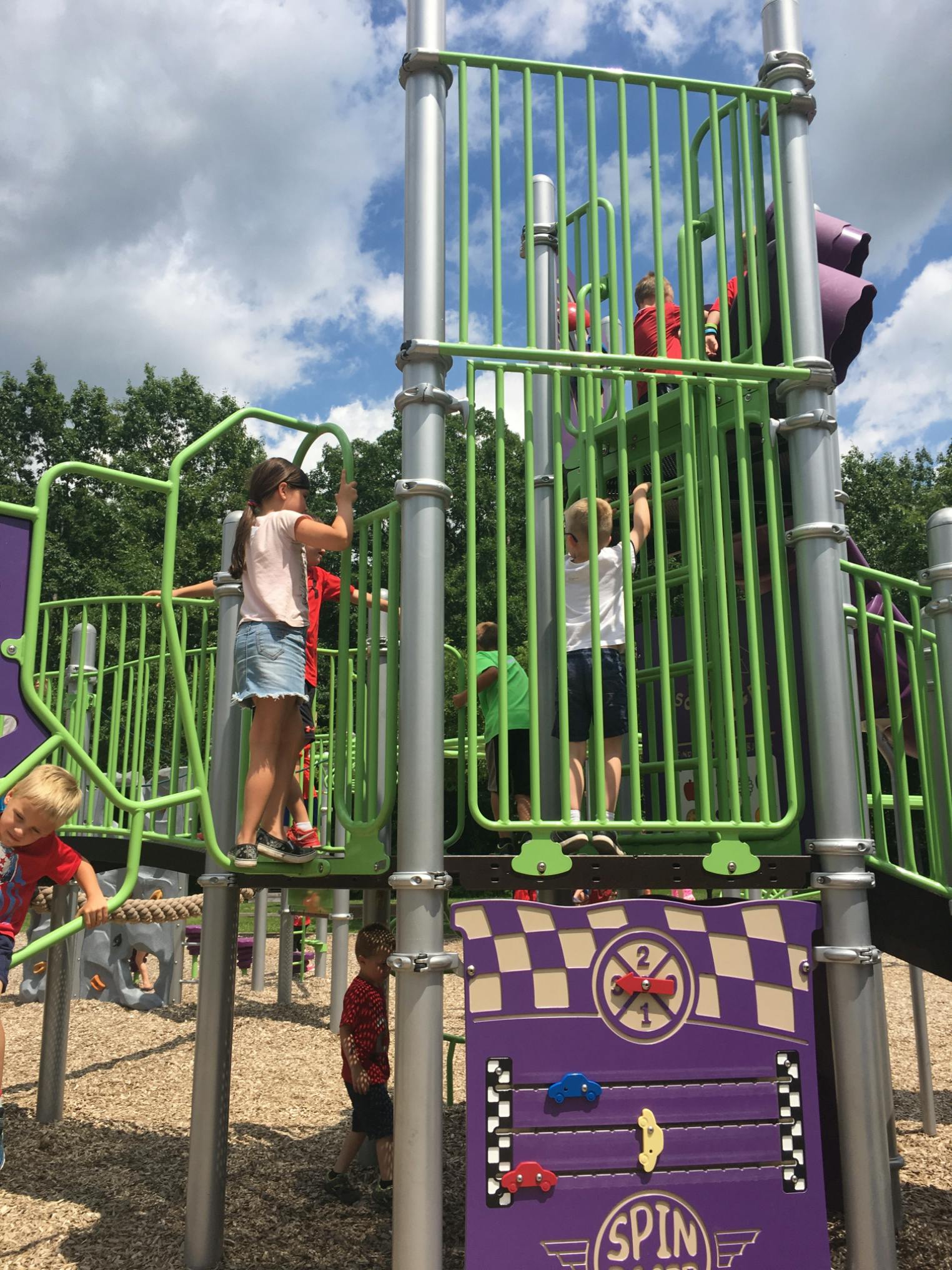 Children playing on a playground structure