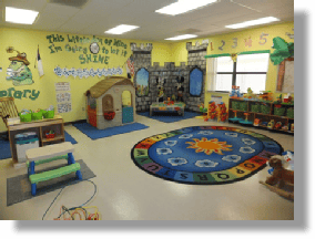 Playroom with a playhouse, castle, and colorful rug