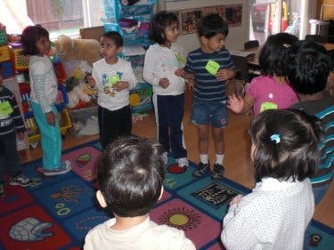 Children standing in a classroom