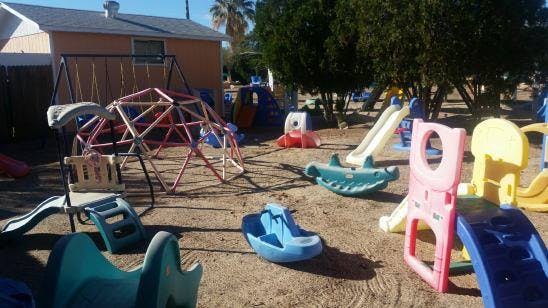 Outdoor playground with various colorful play equipment