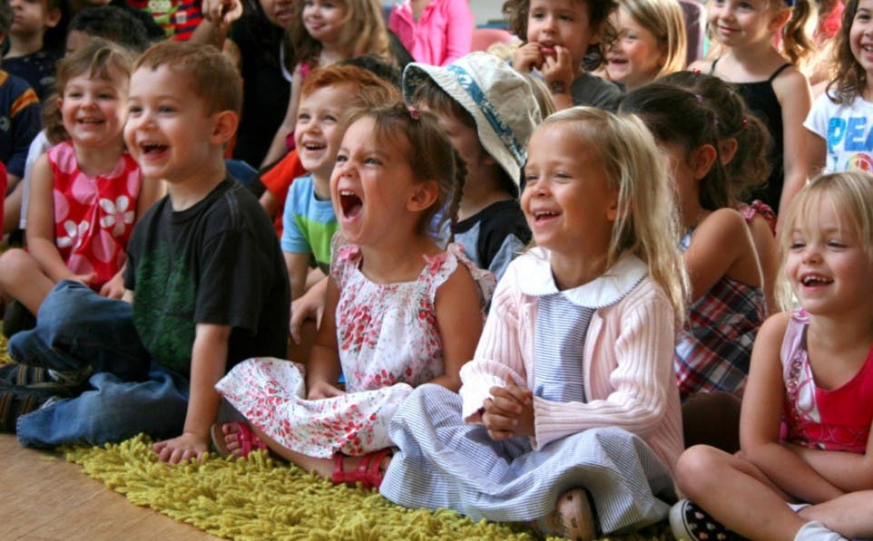 Group of children sitting and laughing