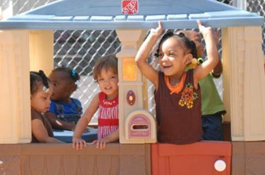 Children playing in a playhouse
