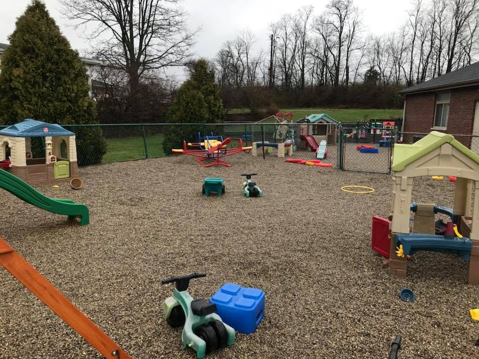 Outdoor playground with various play structures and toys