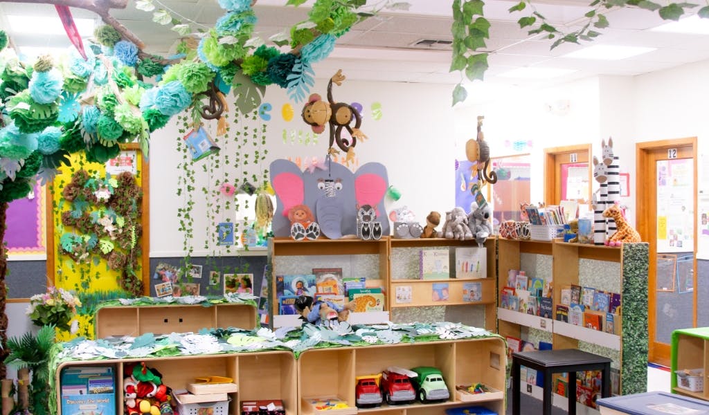 Classroom decorated with paper vines and animal cutouts