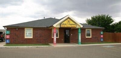 Brick building with a sign that reads "Children's Paradise Child Care Center"