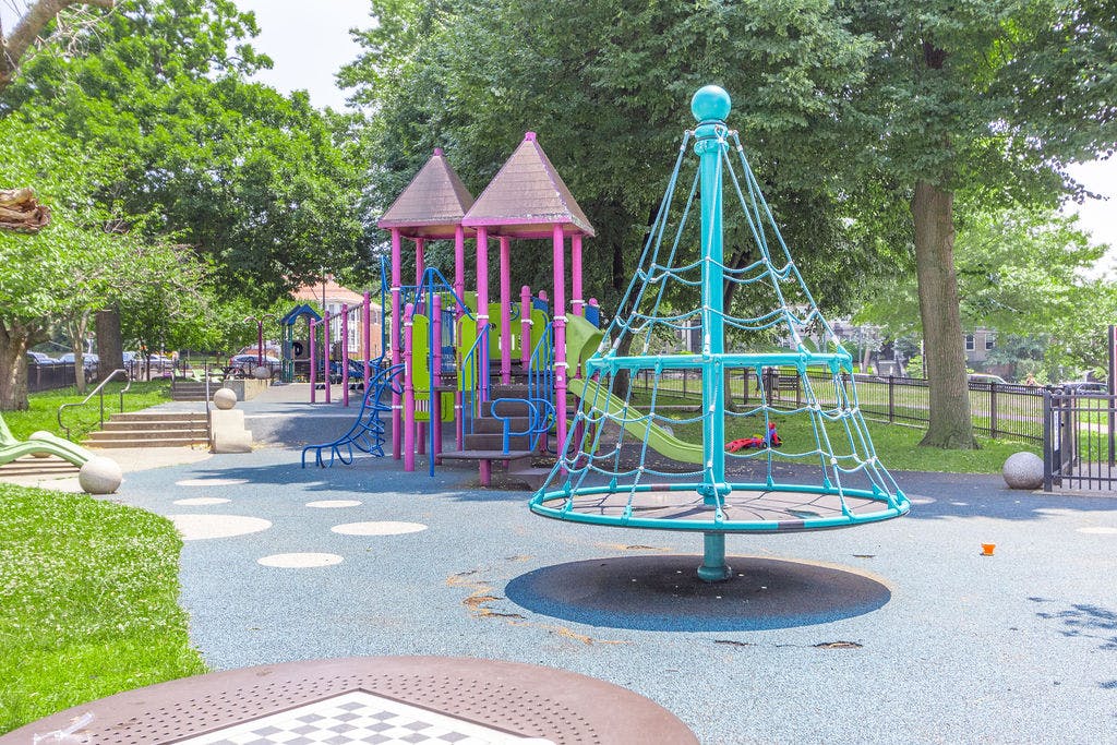 Playground with climbing structure and playhouse