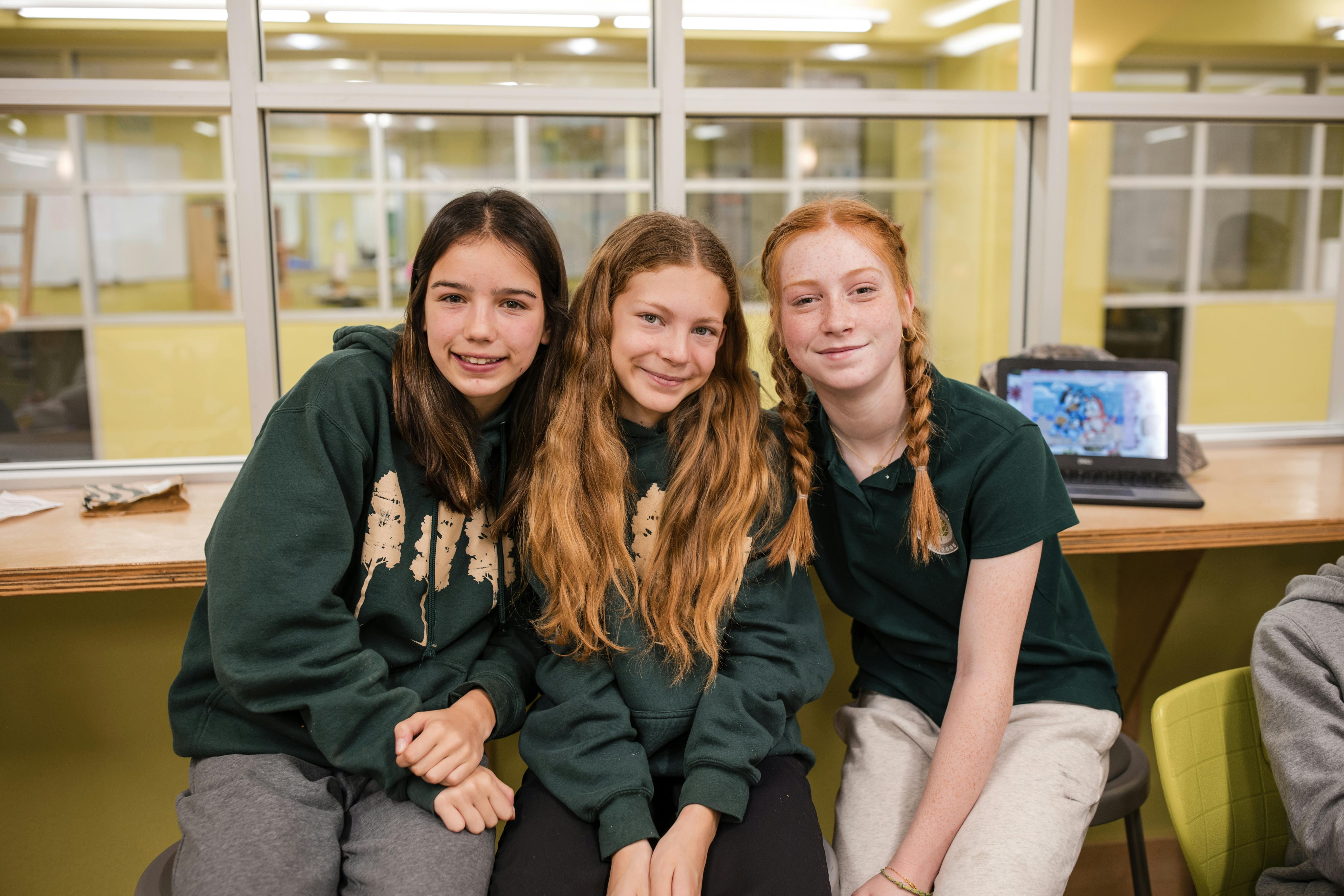 Three teens sitting together