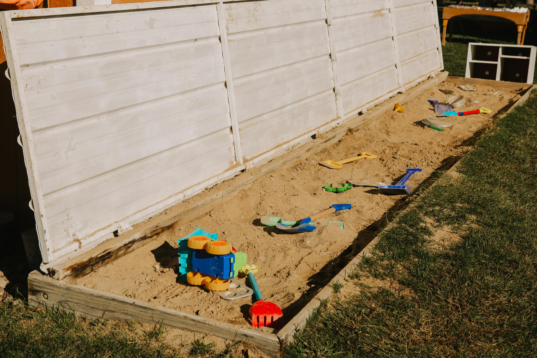 Sandbox with various colorful toys