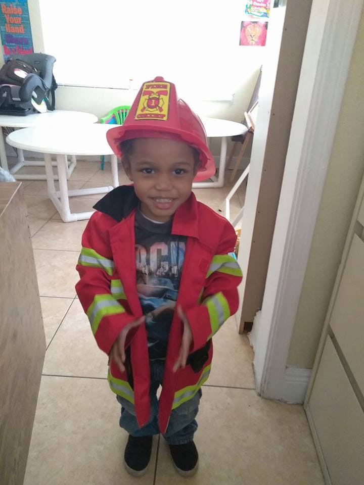 Child in a firefighter costume