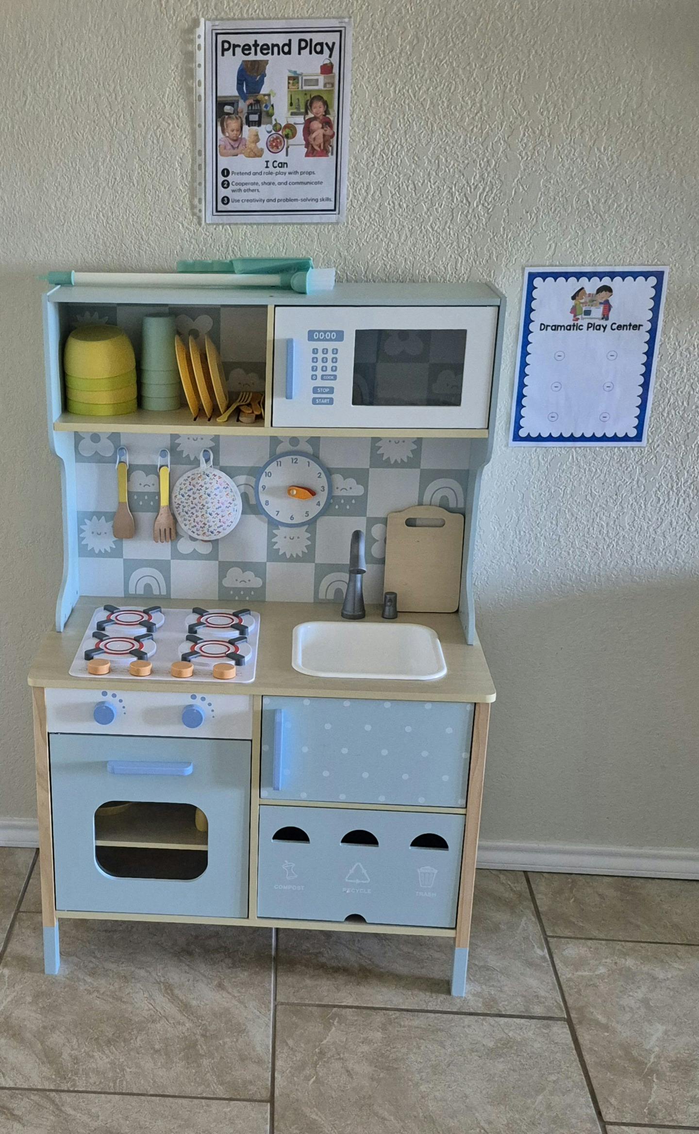 pretend play kitchen set with two informational posters