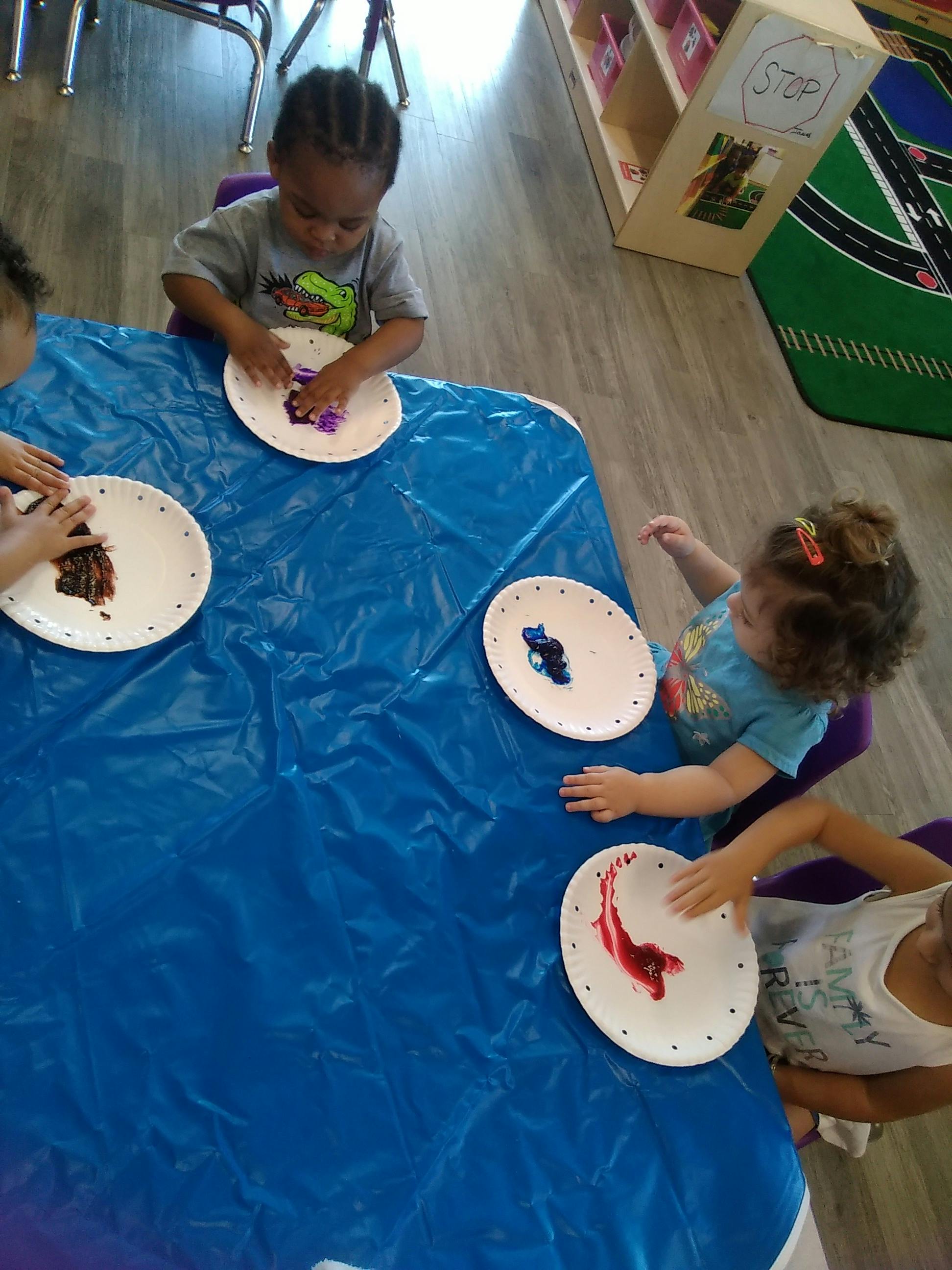 Children doing an art activity at a table