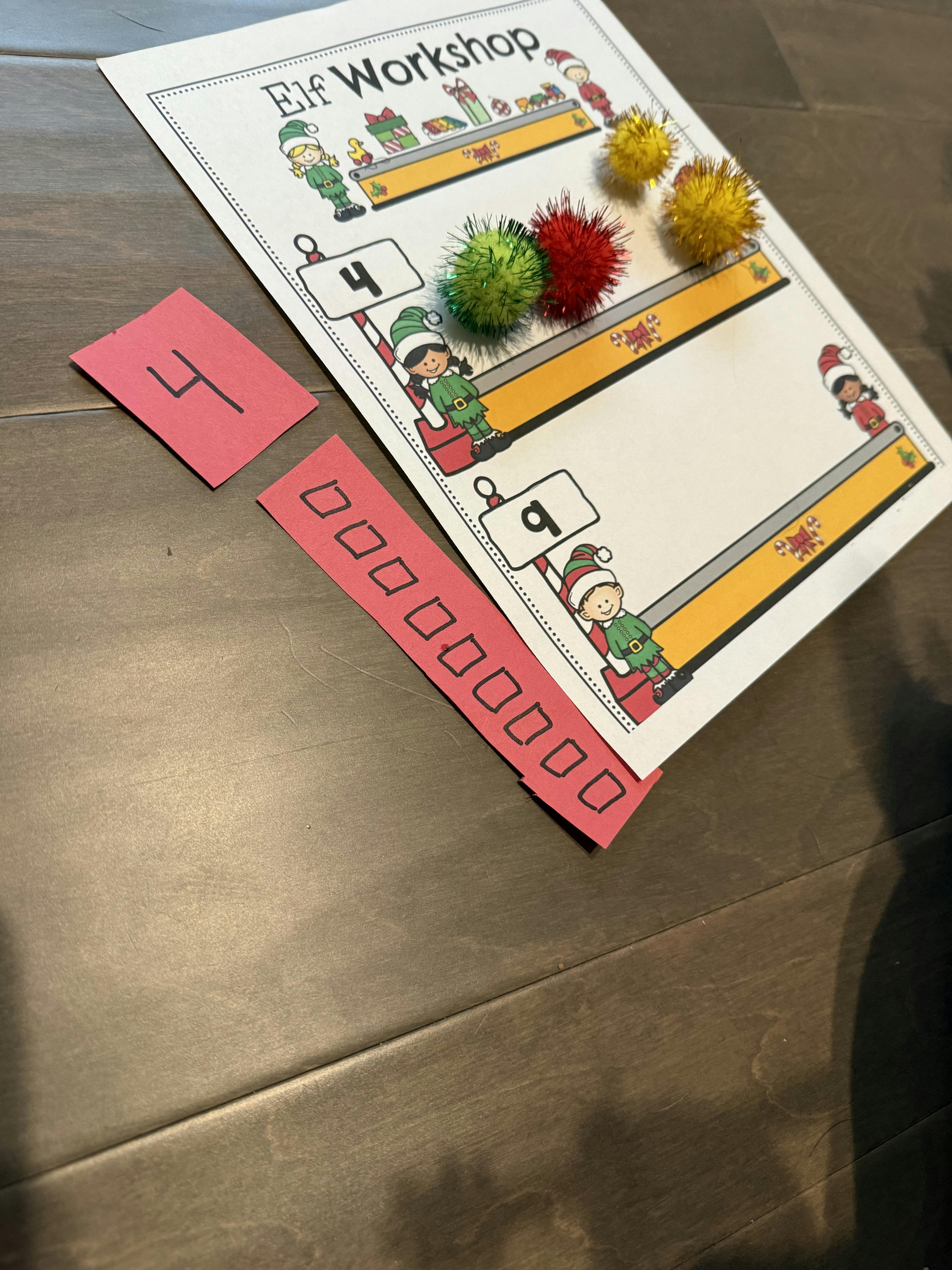 Elf Workshop activity sheet with pom-poms and number cards